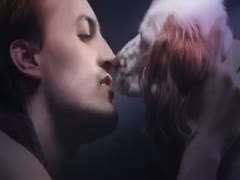 This clip from a beast fetish film features young, attractive beast sex paramours posing with a large dog.